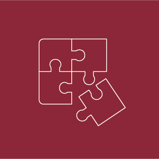 Vier weiße Puzzleteile auf rotem Hintergrund. Symbol für Mergers & Acquisitions, Fusionen und Unternehmenskäufe - TANJA BAUER-ROIKE ÜBERSETZT. Deutsch. Englisch. Rechtliches. Offizielles.